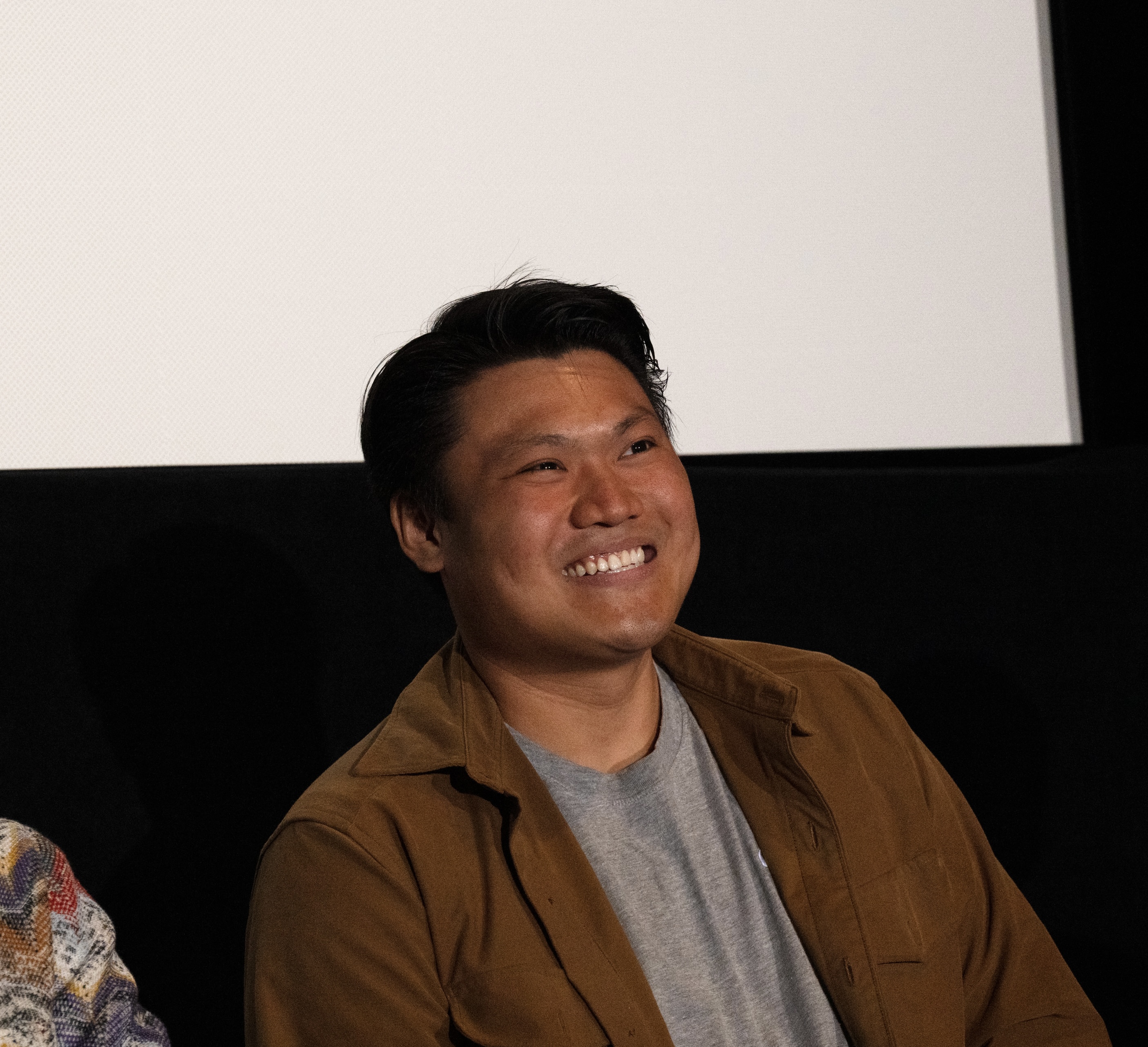 Aaron Wong smiling at the screening